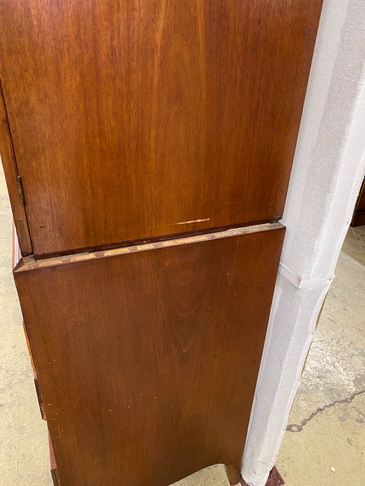 A George III mahogany secretaire linen press, length 122cm, depth 58cm, height 214cm